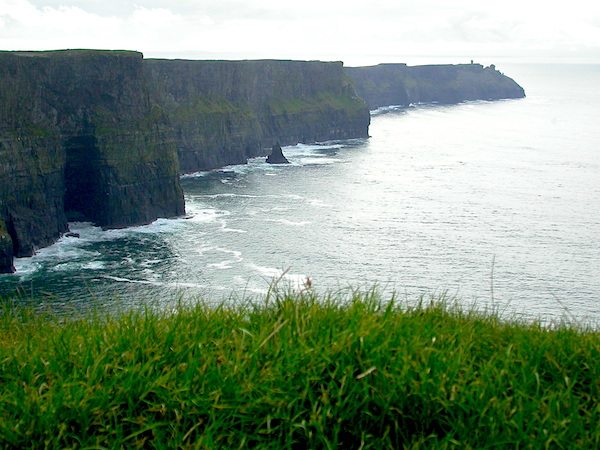 Take in the Cliffs of Moher overlooking the Atlantic Ocean