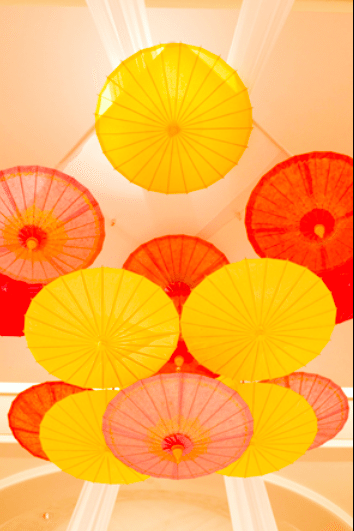 Bright and fun! Paper umbrellas fill the sky Image provided by Finishing Touch Event Design, Ryan Phillips Photography