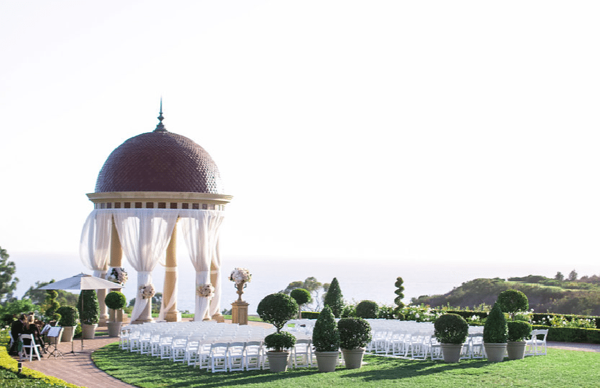 Topiary trees define the space for an elegant wedding Image provided by A Good Affair Event Design